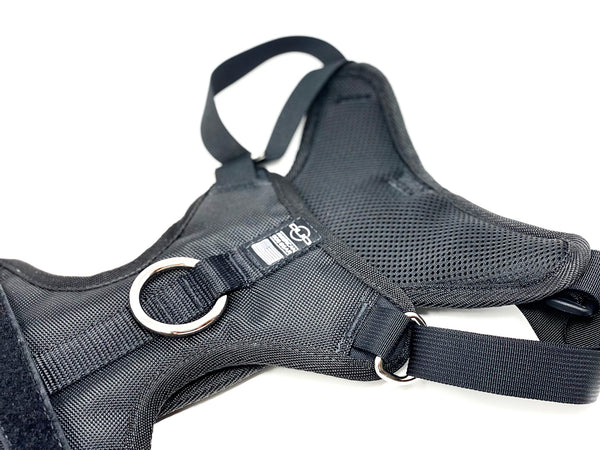 product photo of the top of a black Duo Direct no-pull escape-proof dog harness made in the usa with a lifetime warranty laying flat in a white studio space over a white background